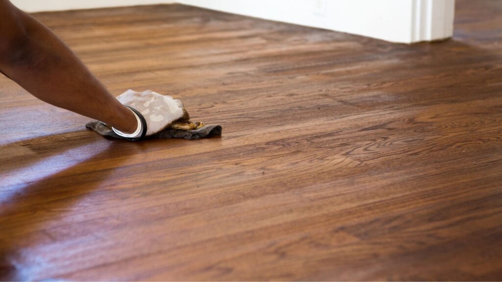 Varied shades of mineral streaks ranging from light gray to olive green and brown on oak hardwood floors, showcasing the natural and unique discolorations that add visual appeal and value to the wood. Stains on Hardwood Floors