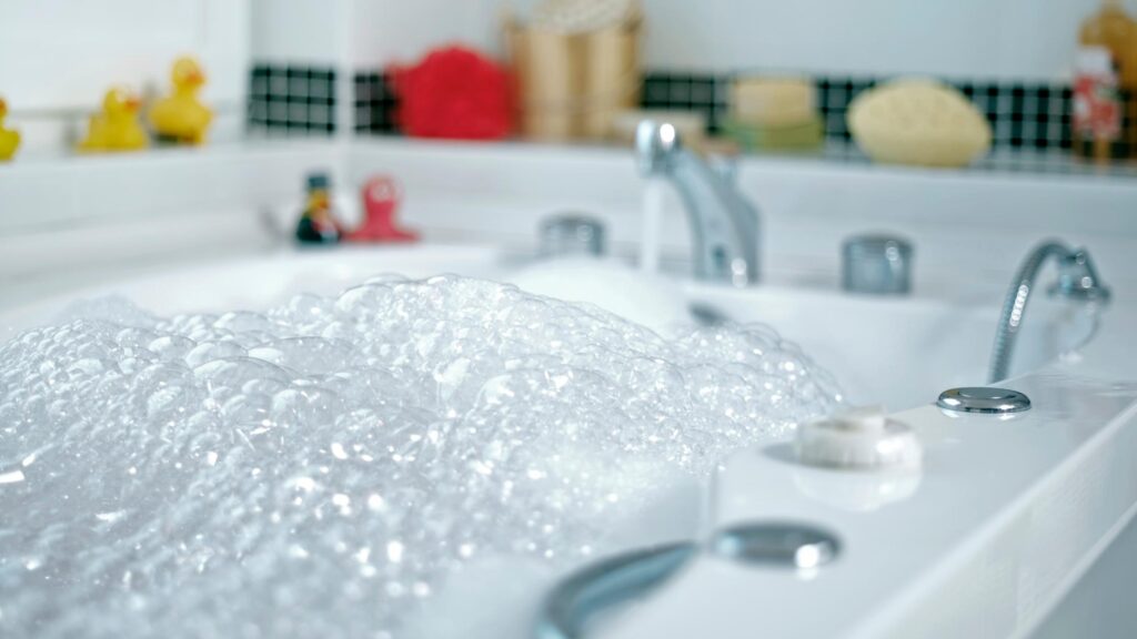 A full clean jet bathtub filled with water, reflecting tranquility and readiness for a soothing bath