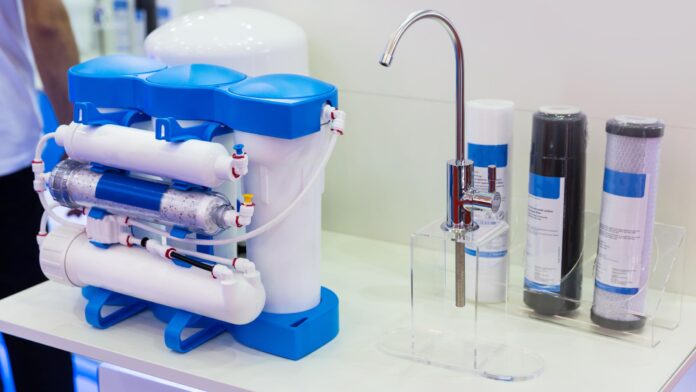 A comprehensive whole-house reverse osmosis system designed to purify water for the entire home, showcasing the central filtration unit with connected pipes and filters in a utility space, ensuring every tap delivers purified water.